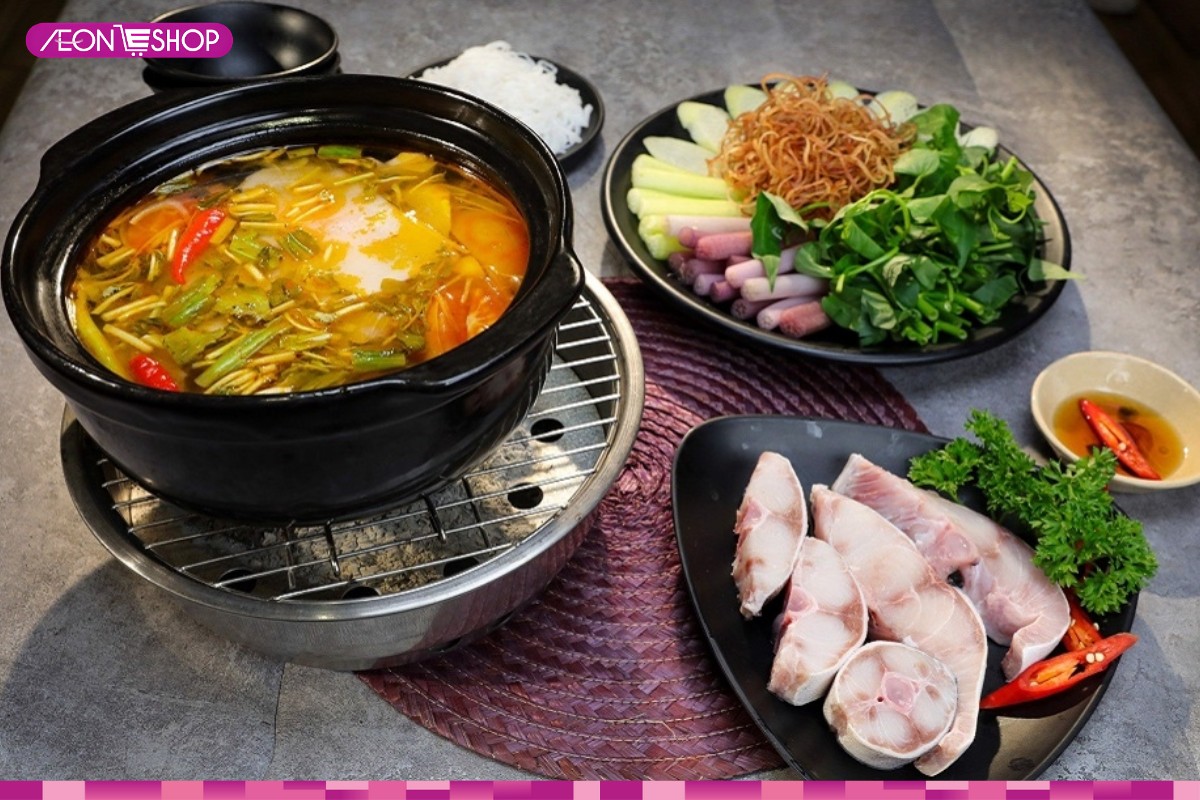 Hoàn thiện và thưởng thức lẩu cá bớp măng chua